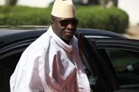 FILE - Gambia's President Yahya Jammeh arrives for a summit to address a seminar on security in Abuja, Nigeria, on Feb. 27, 2014.